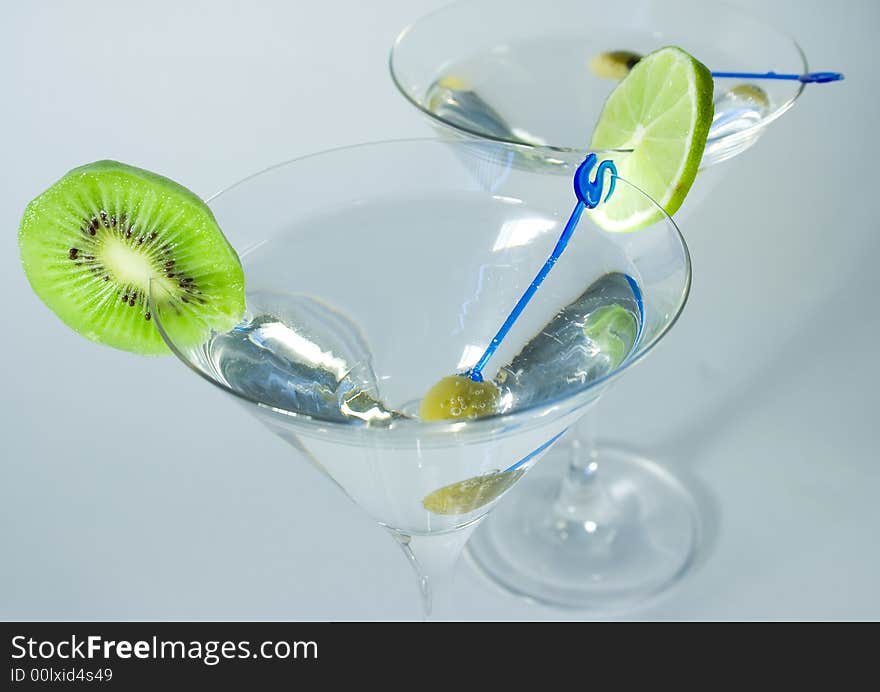 Cocktail glasses with olive, l