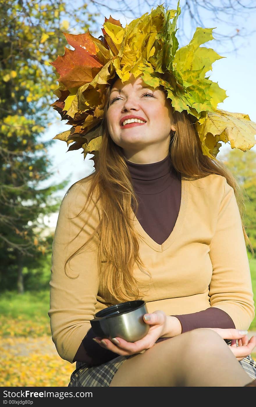 The happy girl on picnic behind city