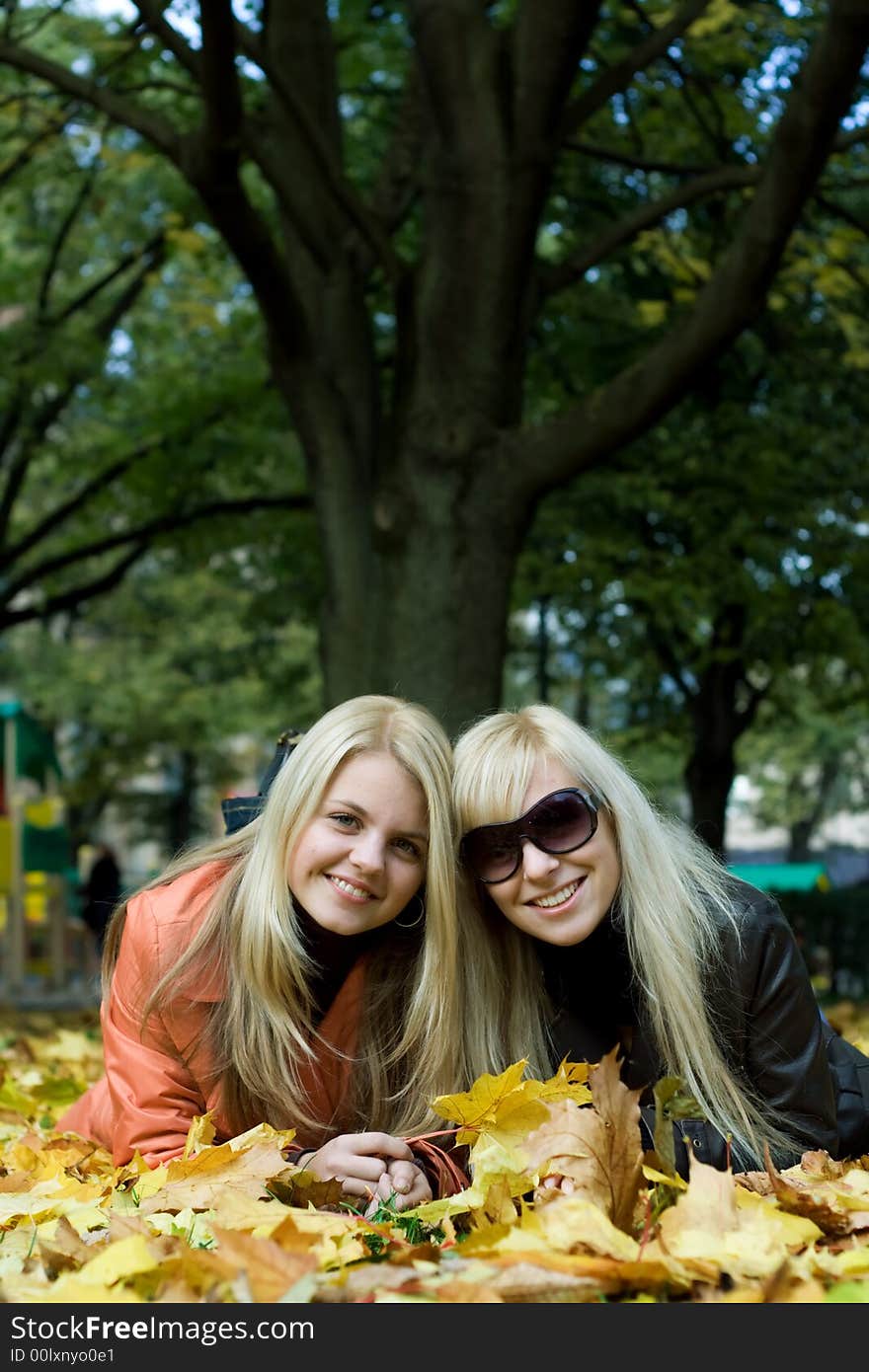 Cute blonde girls on leaves. Cute blonde girls on leaves.