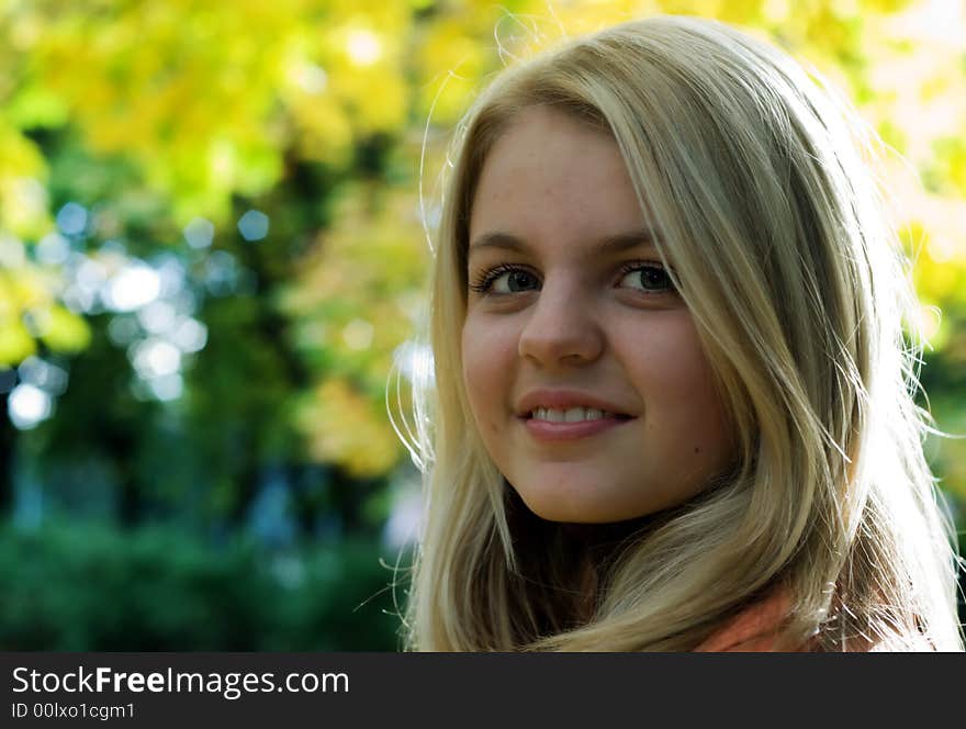 Portret of cute girl in park. Autumn. Portret of cute girl in park. Autumn.