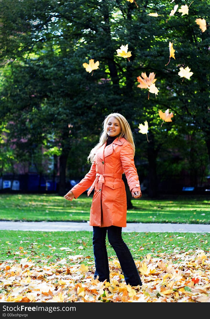 Flying leafs and cute blonde girl. Flying leafs and cute blonde girl.