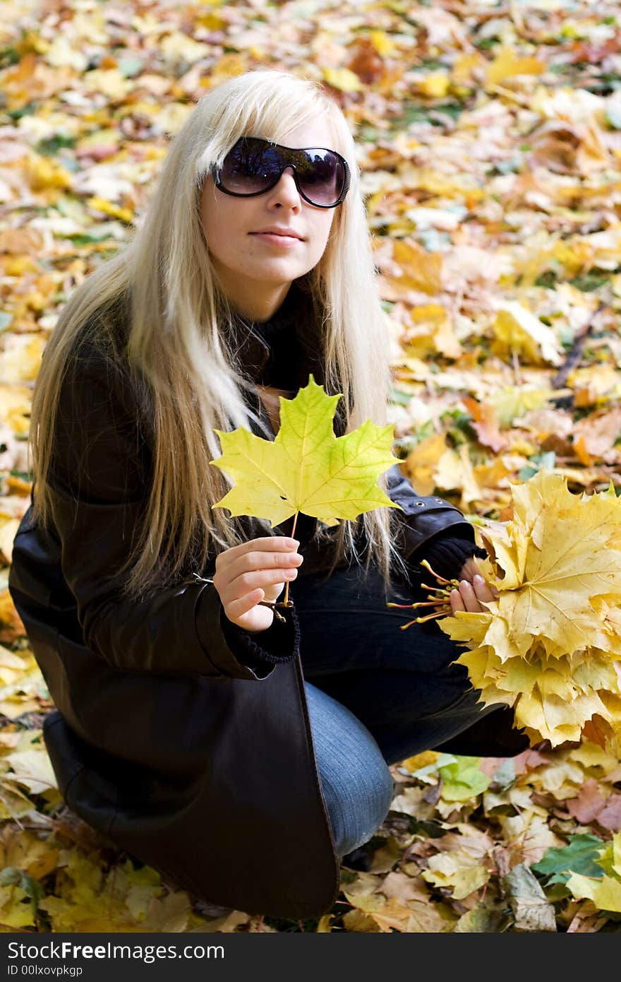 Cute blonde girl holding leaf. Cute blonde girl holding leaf.