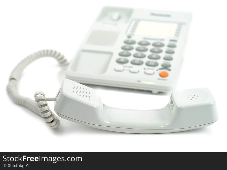 Dropped tube near phone isolated over white background. Dropped tube near phone isolated over white background