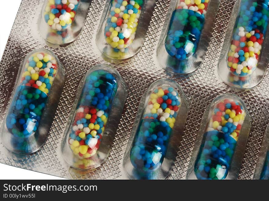 Color pills in capsules and in packing from a foil and plastic. Color pills in capsules and in packing from a foil and plastic