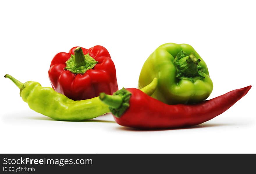 Red and green peppers isolated on white