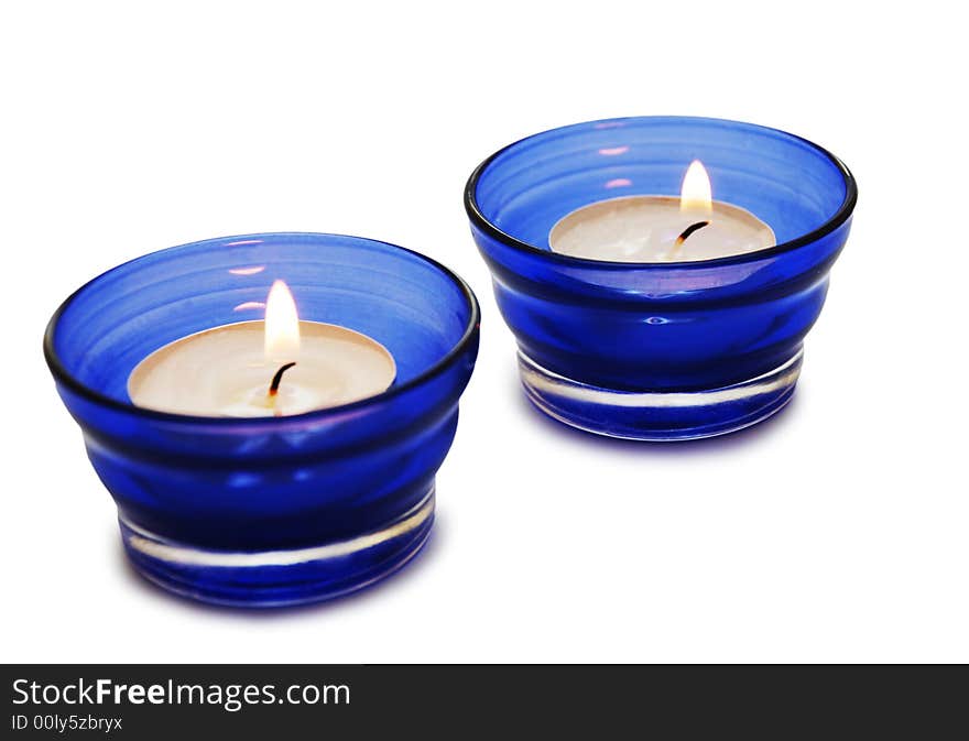 Two blue candles isolated on the white background