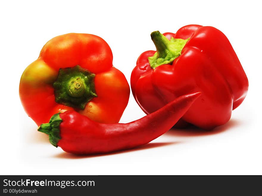 Red and orrange peppers isolatred on white background