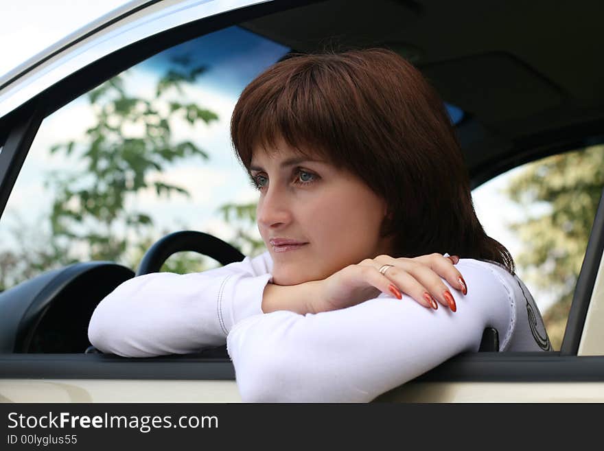 Portrait of the thoughtful girl in automobile. Portrait of the thoughtful girl in automobile