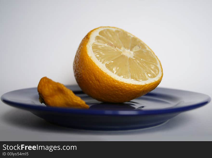 Yellow lemon on the plate.