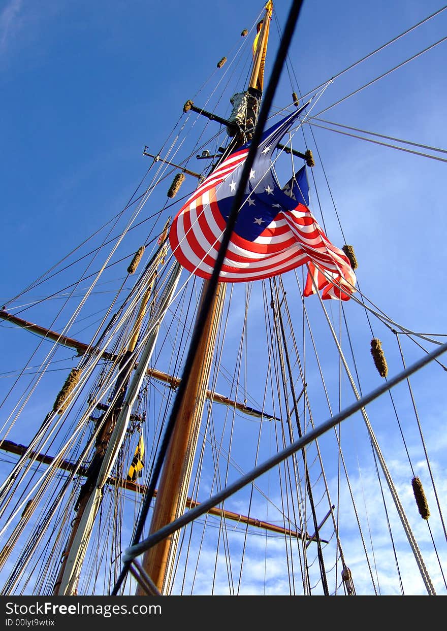 Looking up at an American flag on a ship's mast. Looking up at an American flag on a ship's mast