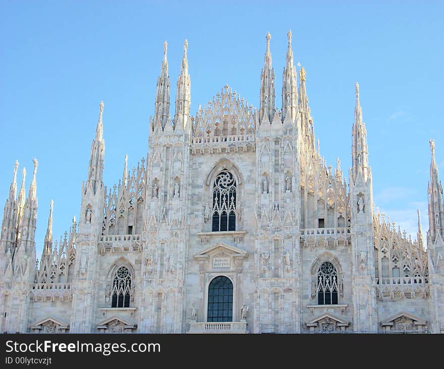 The front of the milan's dome under a clear blue sky. The front of the milan's dome under a clear blue sky