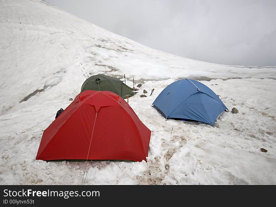 Mountain tents standing on a glacier. Mountain tents standing on a glacier.