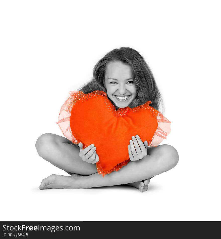 Beautiful smiling girl embraces red heart over white background. Beautiful smiling girl embraces red heart over white background