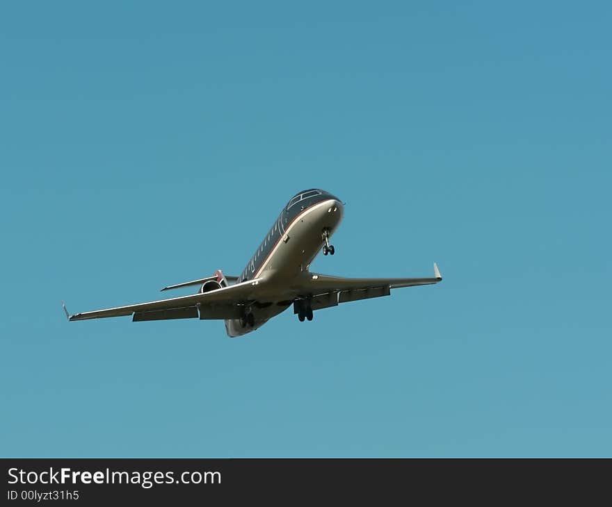 Commercial jet in flight with a bright blue sky in the background. copy space included. Commercial jet in flight with a bright blue sky in the background. copy space included