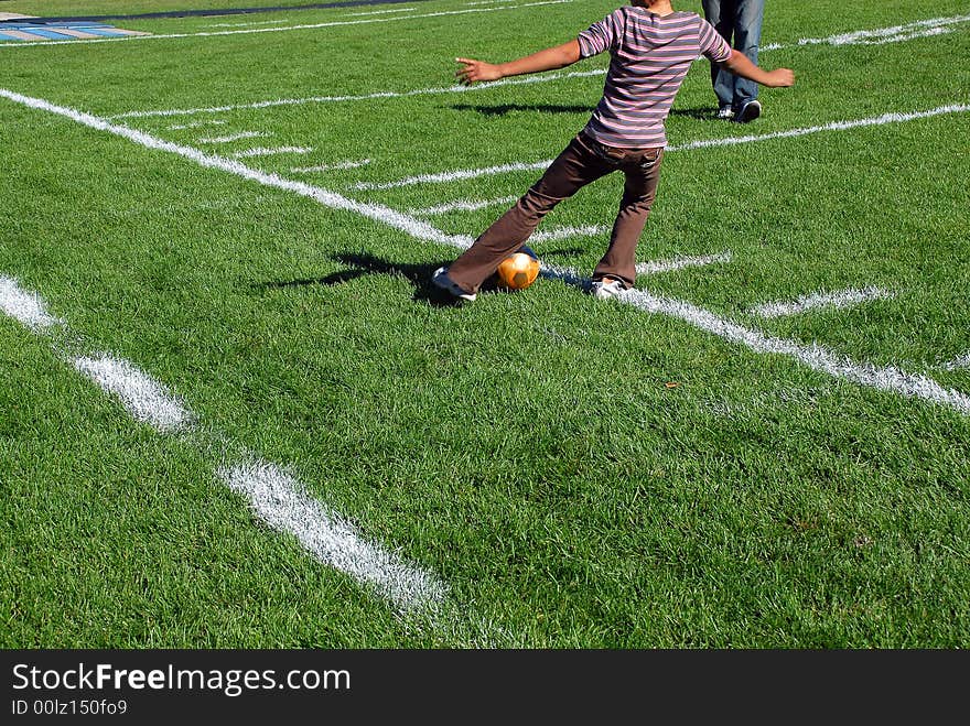 Lower body shot of a girl playing soccer. Lower body shot of a girl playing soccer