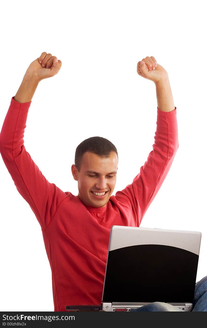 Young happy man working on laptop isolated on white background. Young happy man working on laptop isolated on white background