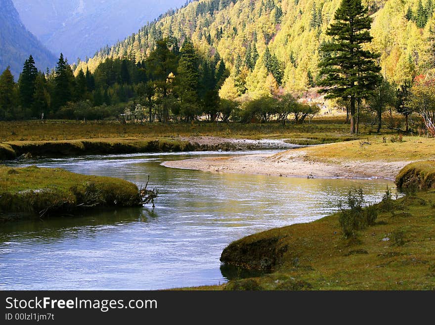 River flow amond the mountains.