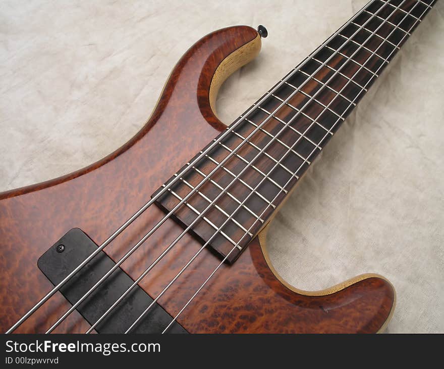 Wood Bass Guitar with body, neck and strings. Wood Bass Guitar with body, neck and strings