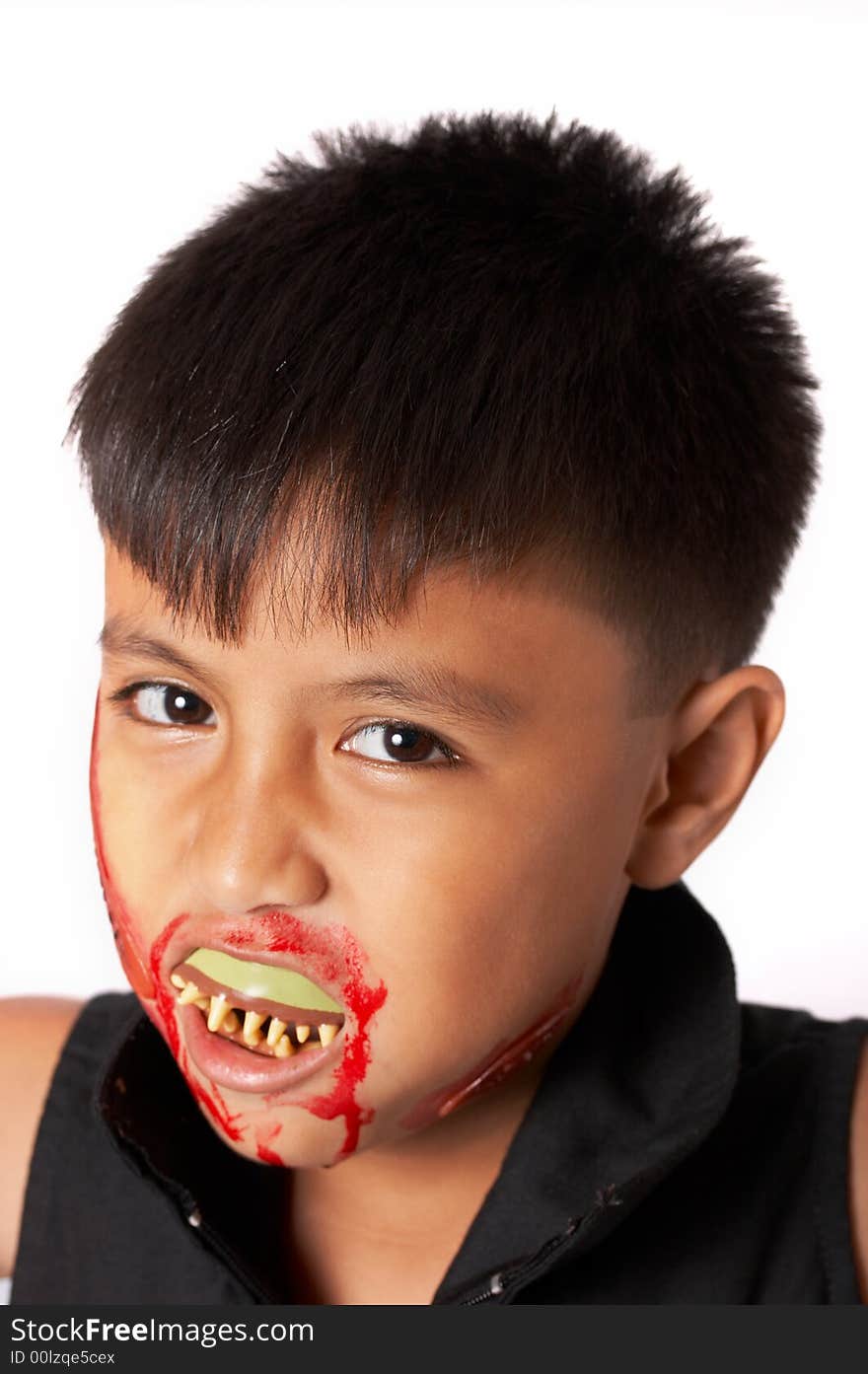 A boy disguised in halloween over a white background. A boy disguised in halloween over a white background