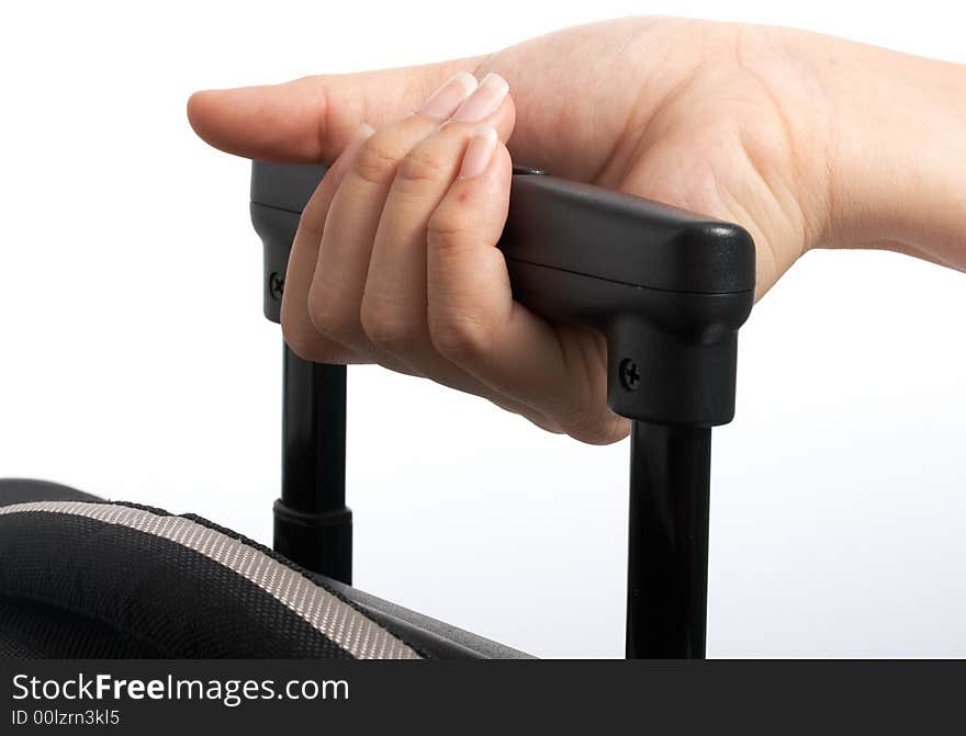 A hand carrying a bag over a white background. A hand carrying a bag over a white background