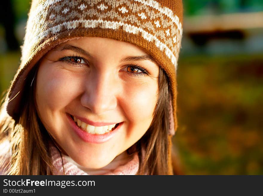 Autumn Portrait - Beautiful young girl in the park with golden light. Autumn Portrait - Beautiful young girl in the park with golden light