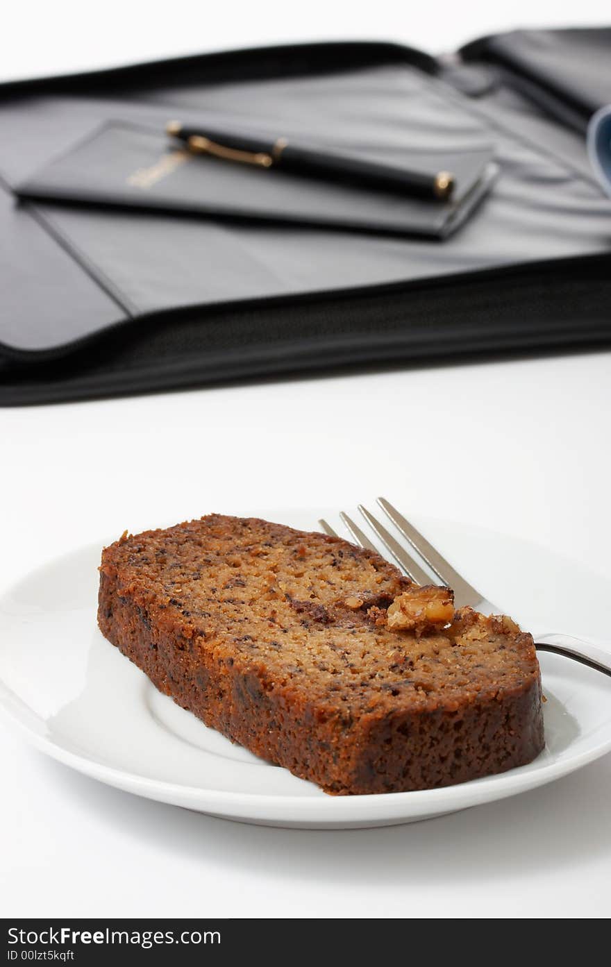 A slice of cake over a white background. A slice of cake over a white background