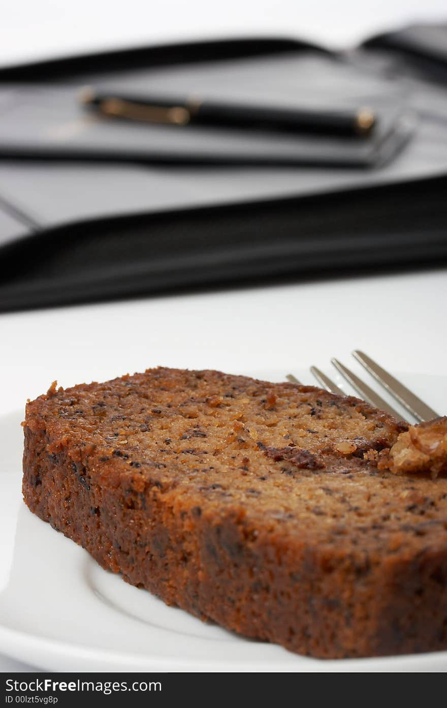 A slice of cake over a white background. A slice of cake over a white background