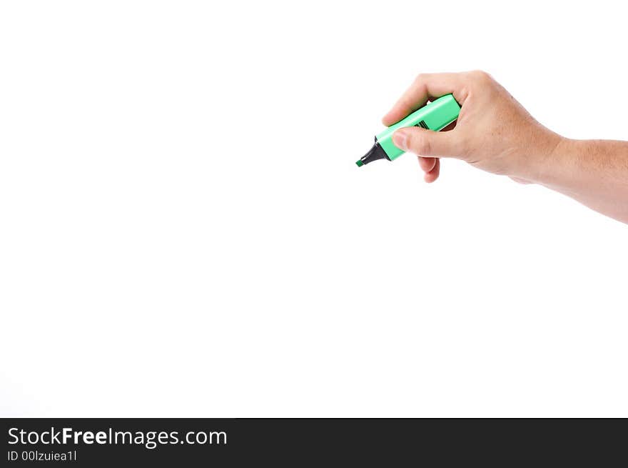 A hand holding a green marker over a white background