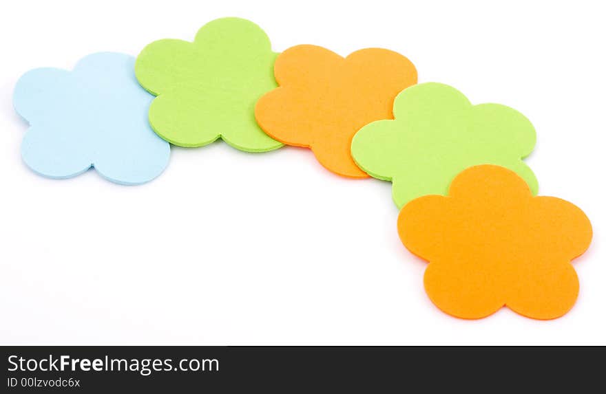 Colorful foam stickers over a white background