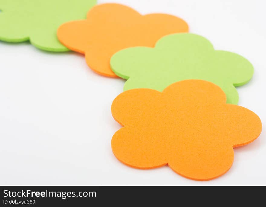 Colorful foam stickers over a white background