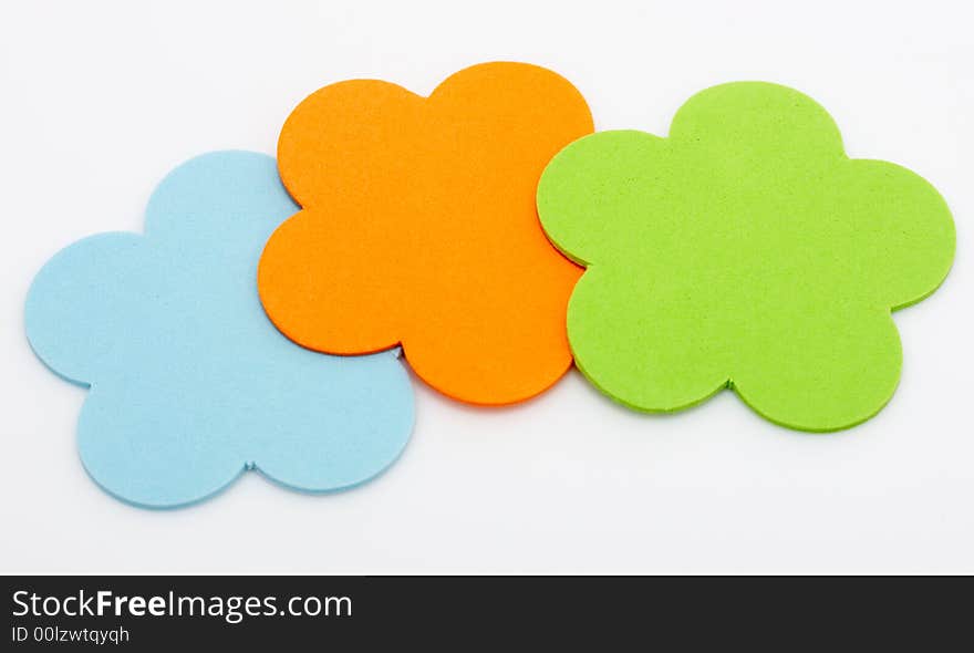 Colorful foam stickers over a white background