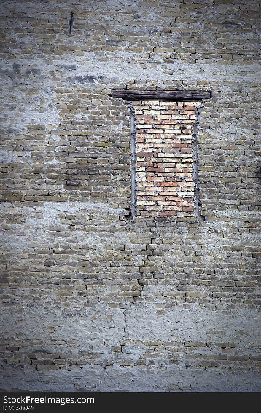 Dirty cracks wall with brick up window. Dirty cracks wall with brick up window