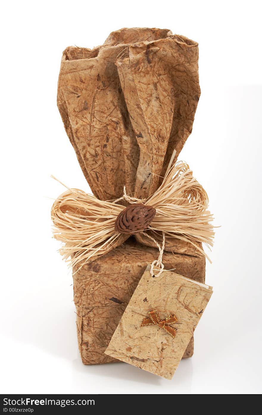 A brown gift box over a white background