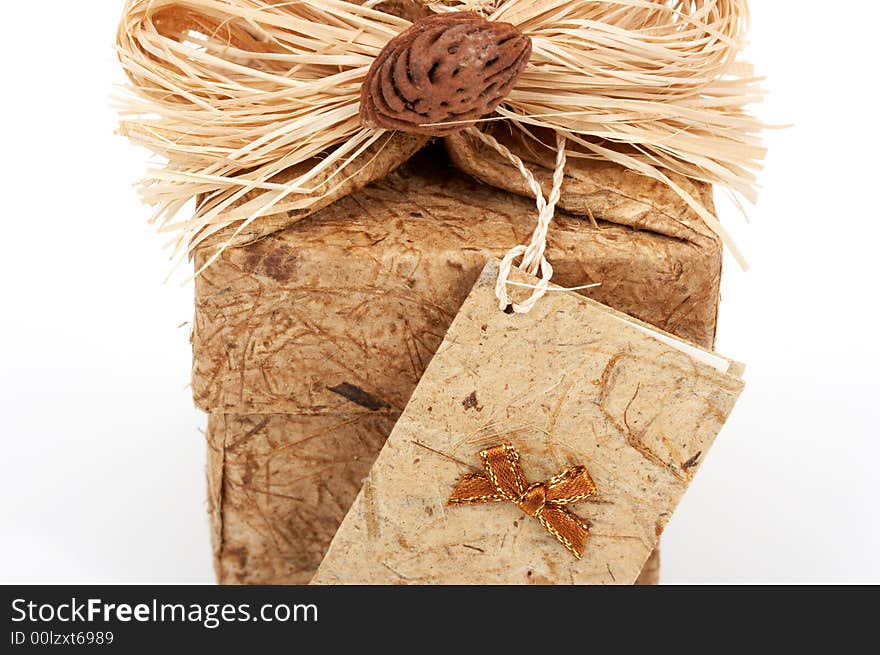 A brown gift box over a white background