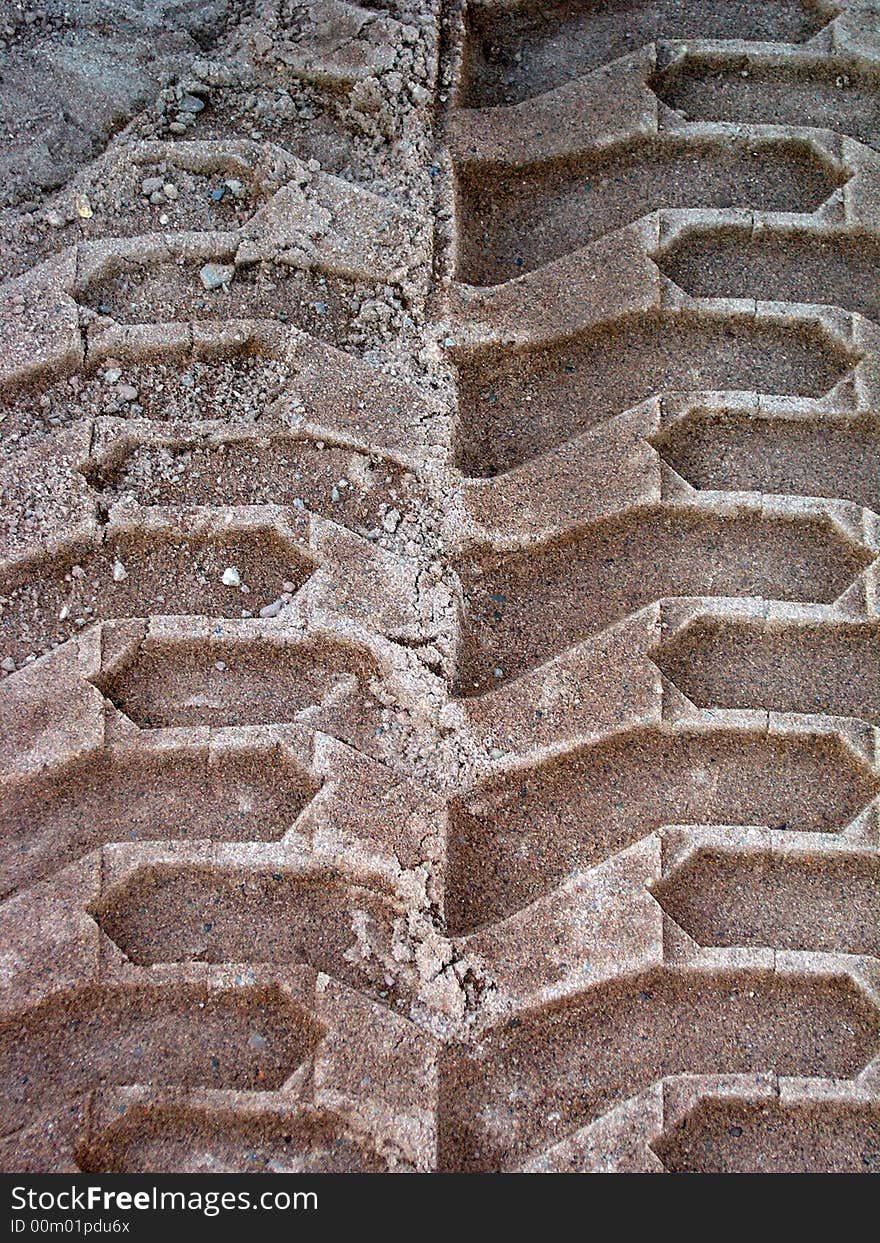 An ephemeral impression in the sand of a passing truck. An ephemeral impression in the sand of a passing truck.