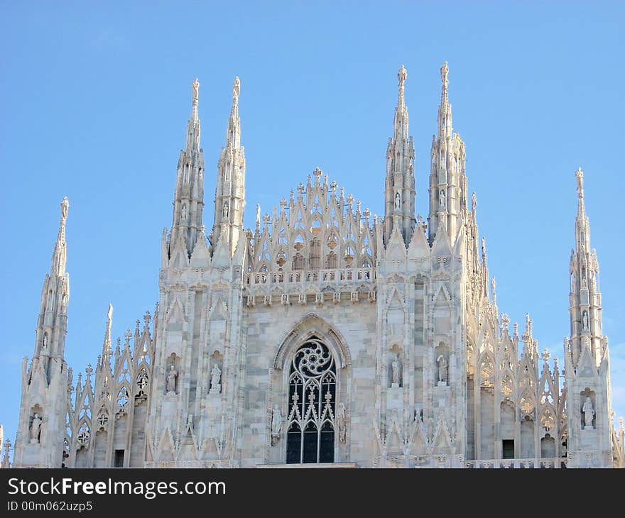 The front of the dome in Milan under a clear blu sky. it's magnificent. The front of the dome in Milan under a clear blu sky. it's magnificent.