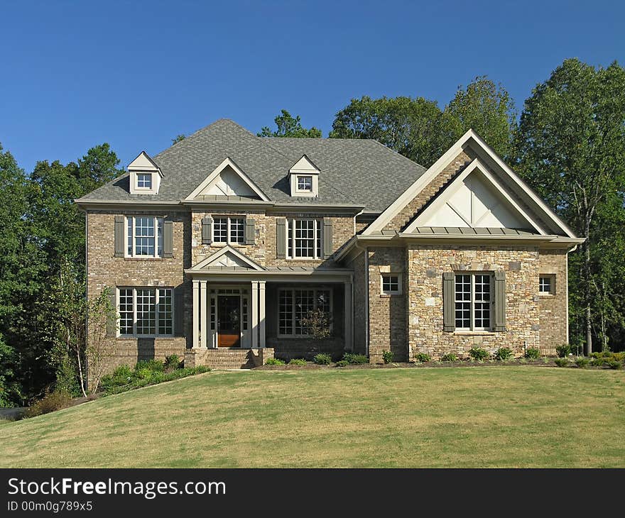 Luxury Home Exterior against blue sky. Luxury Home Exterior against blue sky