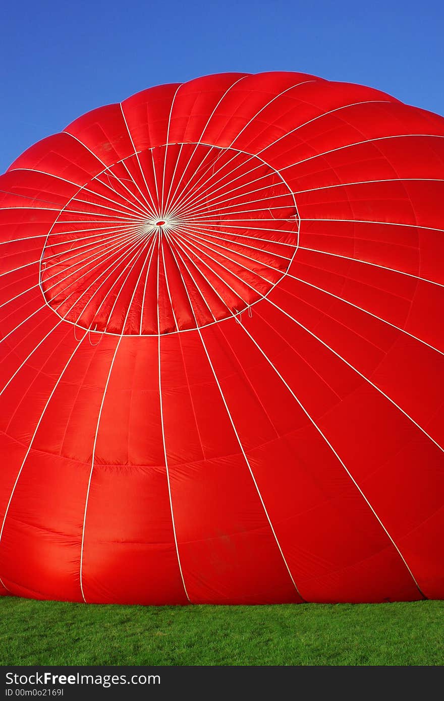 Red air balloon getting ready for a flight