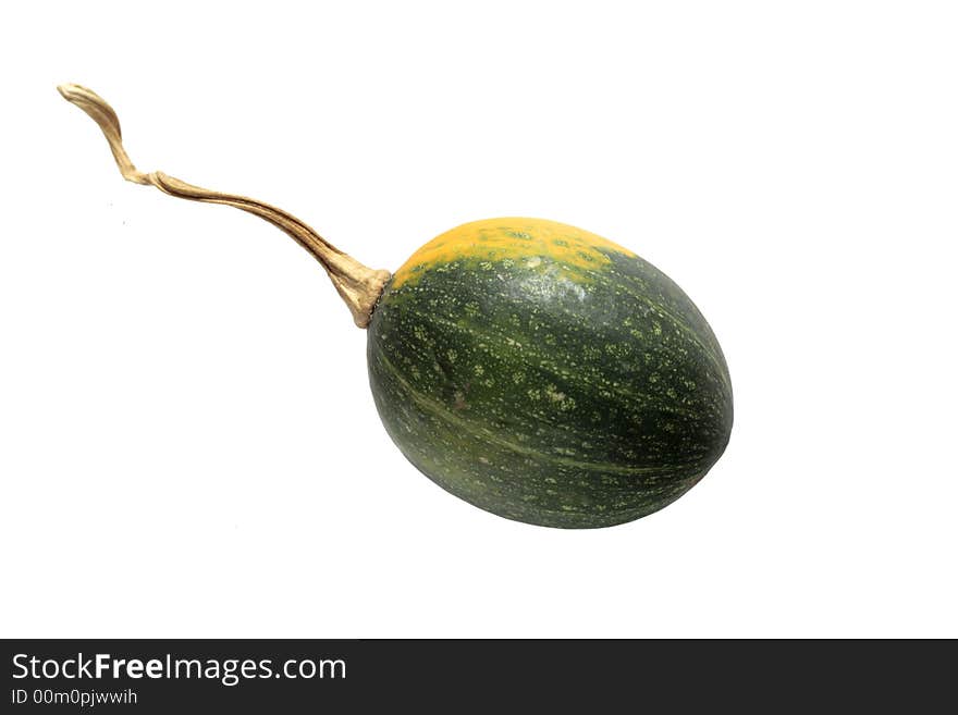 Yellow and green gourd with stem, isolated on white background