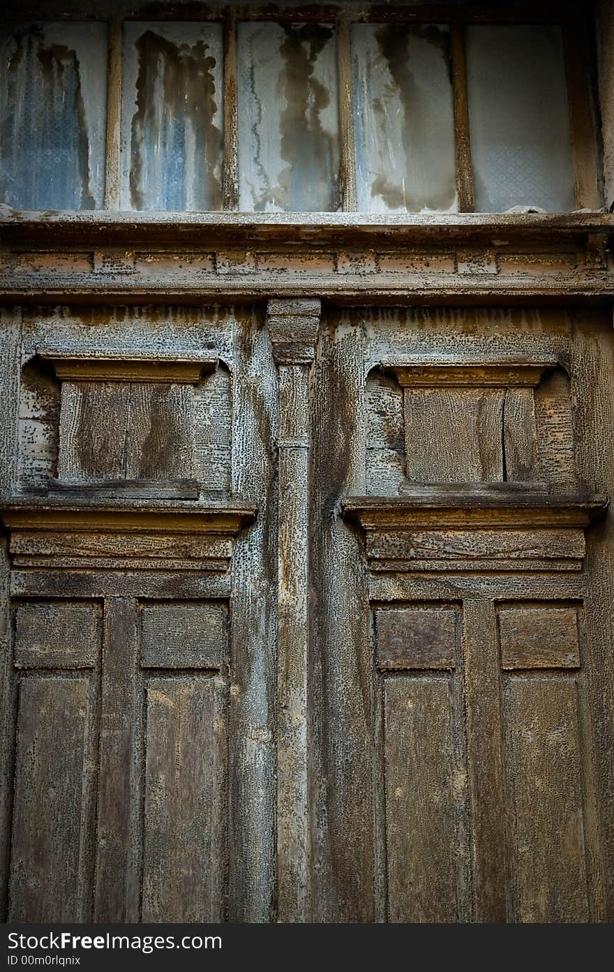 Old broken, damaged door on the classic building. Old broken, damaged door on the classic building