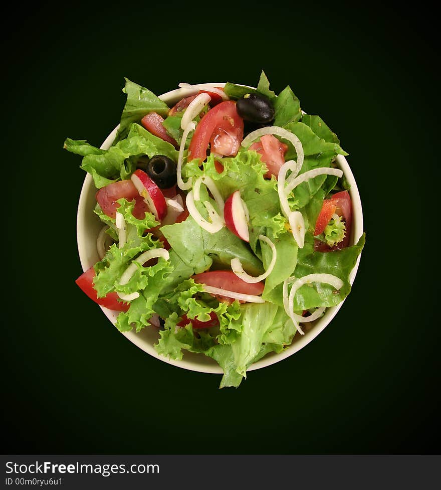 Fresh salad with onion, tomato and basil