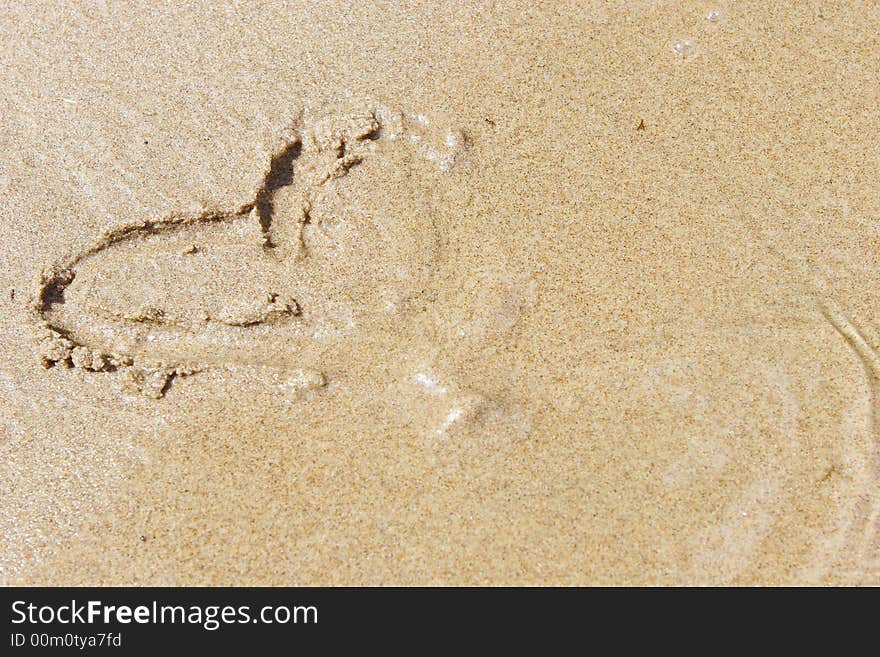 Heart drawn on golden sand. Heart drawn on golden sand