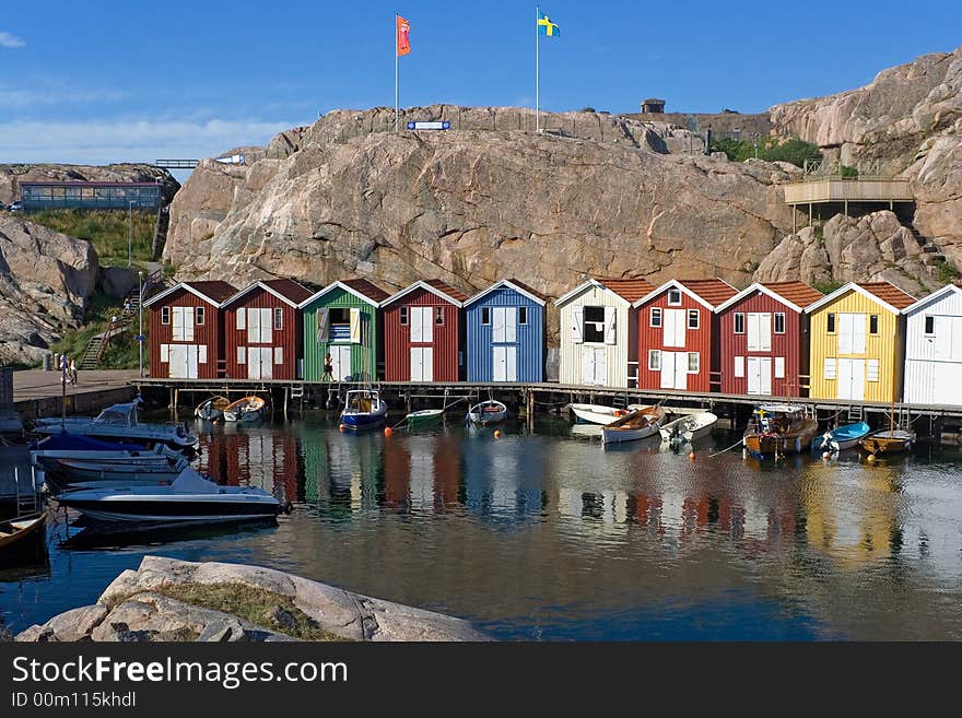 Multy-color boat-houses in small fising village on swedesh west-coast. Multy-color boat-houses in small fising village on swedesh west-coast