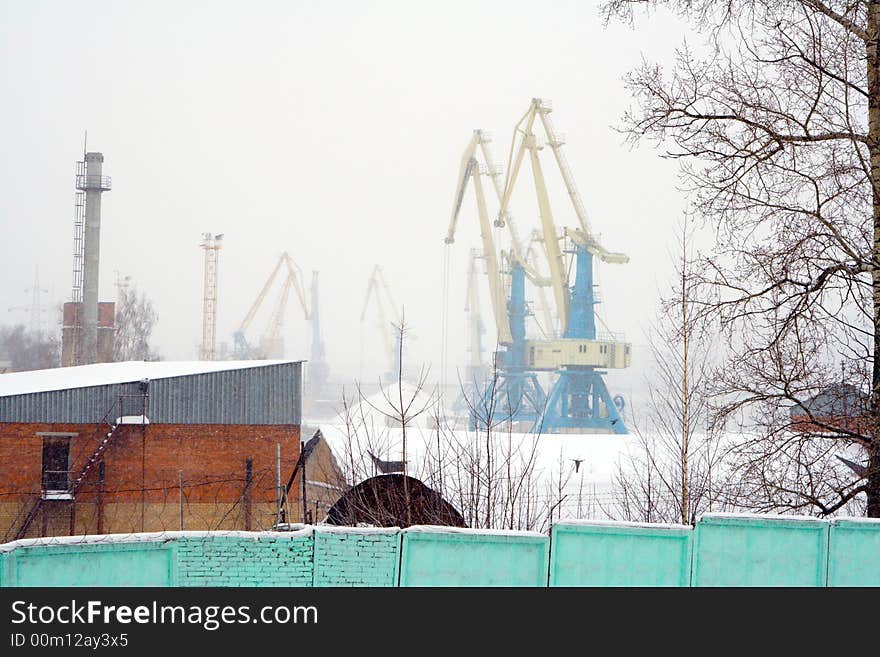 View on construction site with several tower cranes. View on construction site with several tower cranes