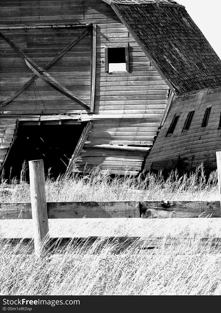 Old Delapitated Abandoned Barn in Farmyard. Old Delapitated Abandoned Barn in Farmyard