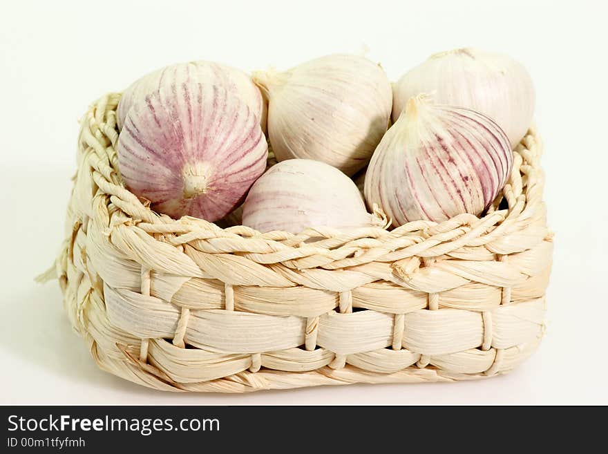 Garlic bulbs in a little basket