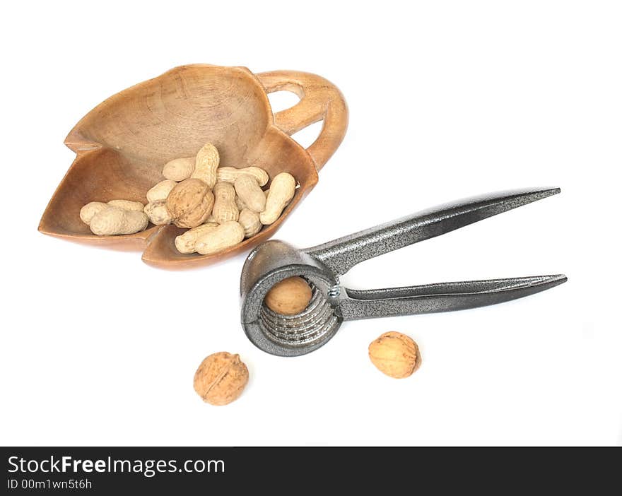 Nutcracker and nuts on the white background