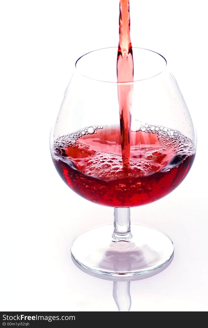 Pouring red wine into the glass - first from series