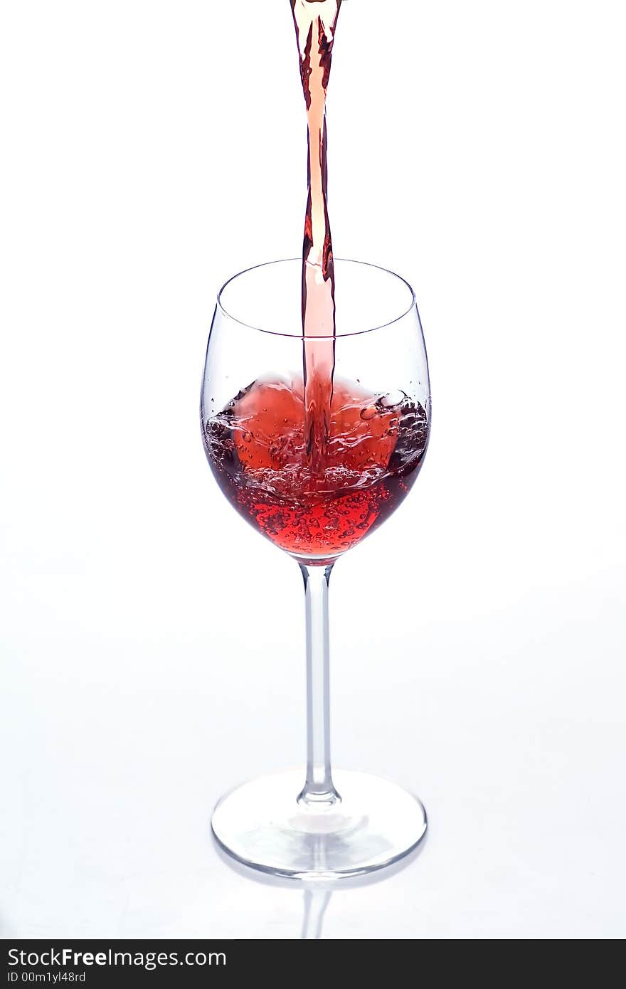 Pouring red wine into the glass - first from series