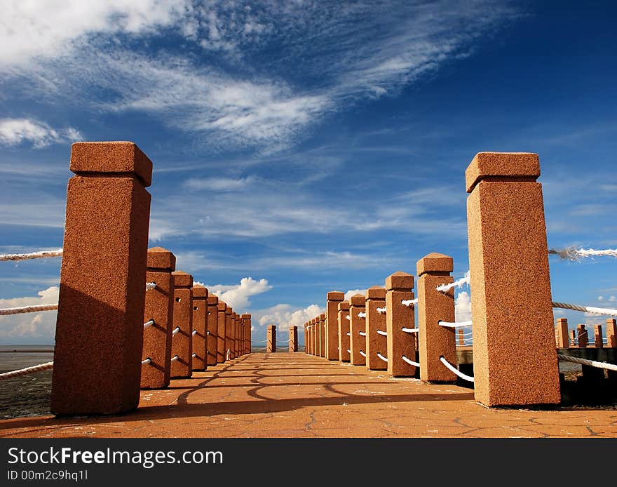 Beautiful focus a port jetty image on the blue sky background